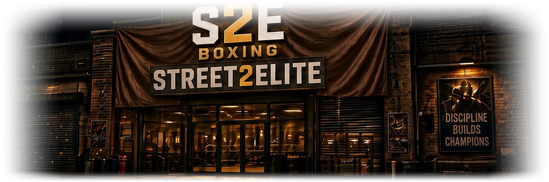 A brick warehouse gym at night with a Street2Elite banner over the door.
